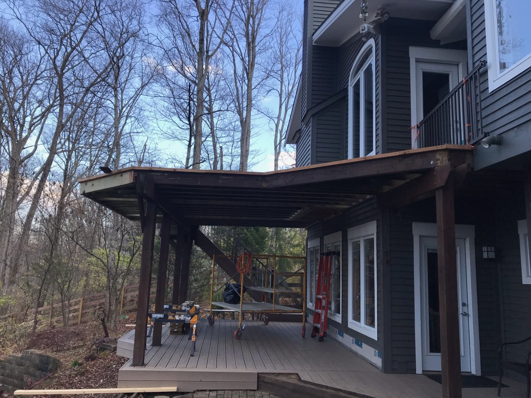 patio with roof attached to home